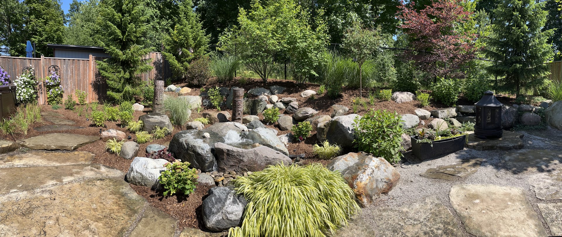 Rock garden with natural stone paths and ornamental plantings